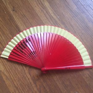 Red plastic hand fan with bull cut out from Spain